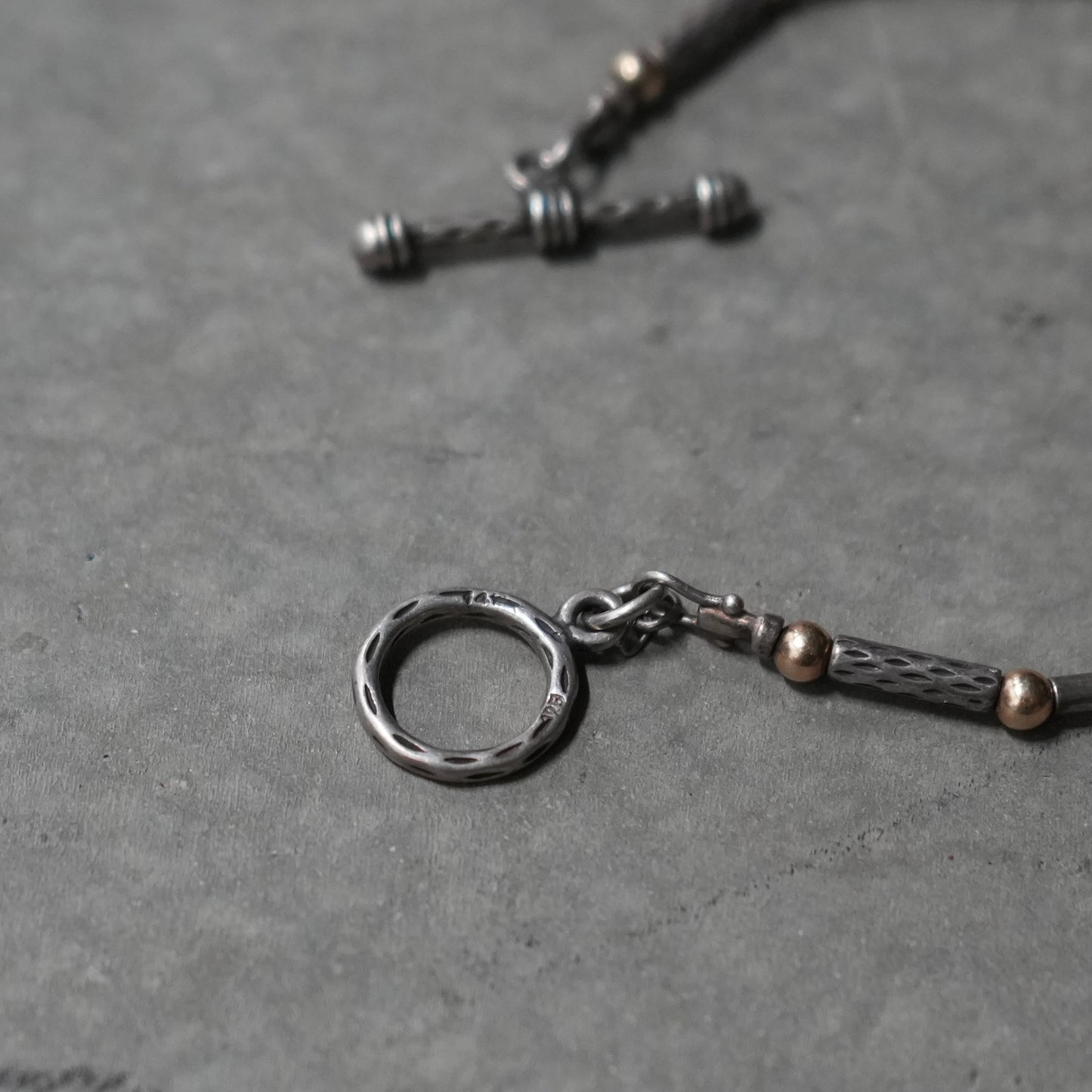 silver and gold toggle closure bracelet 