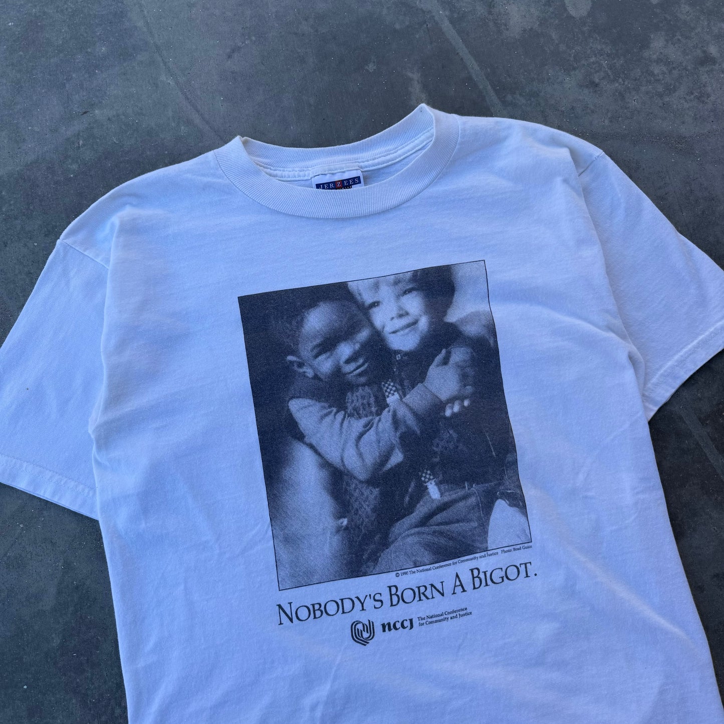 90s nobody’s born a bigot tee