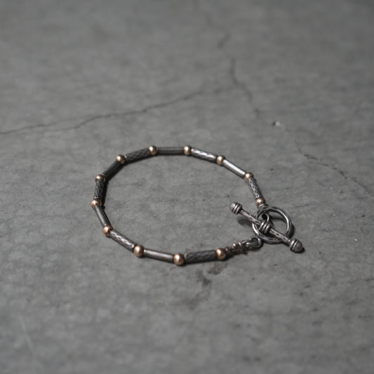 silver and gold toggle closure bracelet ￼